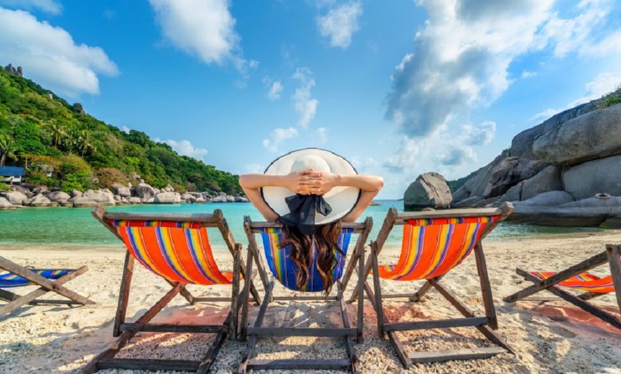 woman-with-hat-sitting-on-chairs-beach-in-beautiful-tropical-beach-woman-relaxing-on-tropical-beach-at-koh-nangyuan-island-780x470